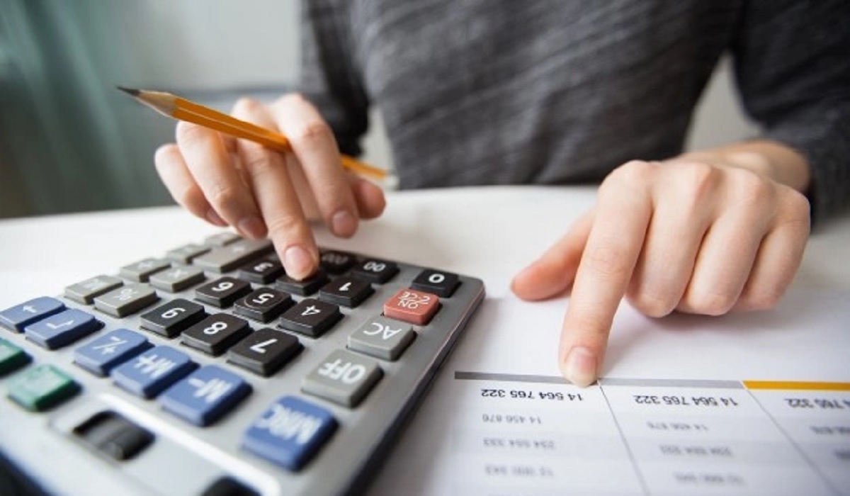 Accountant using a calculator